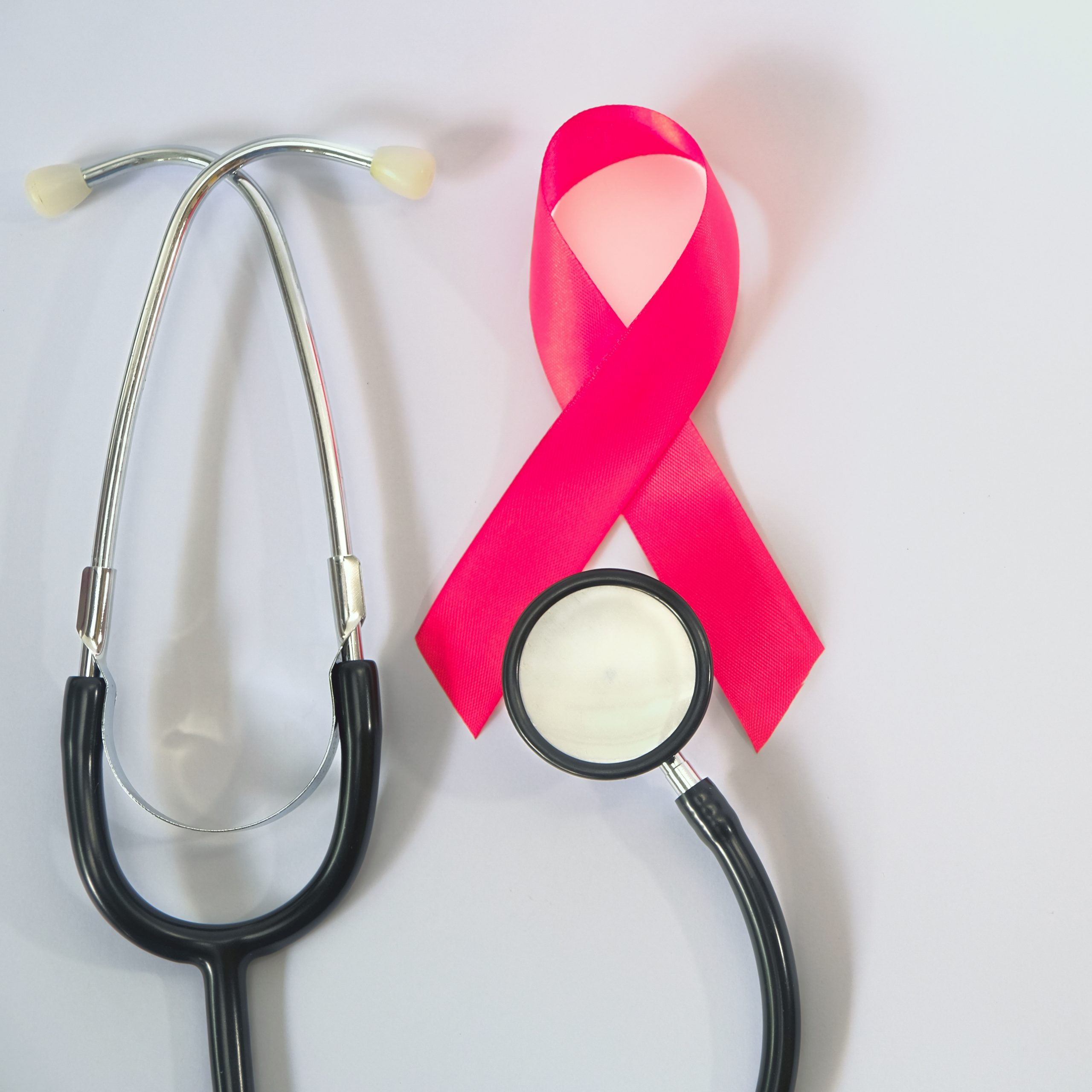 Photo of a stethoscope with a red ribbon