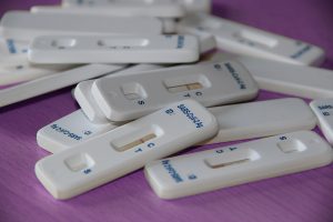photo of numerous at-home covid test kit devices