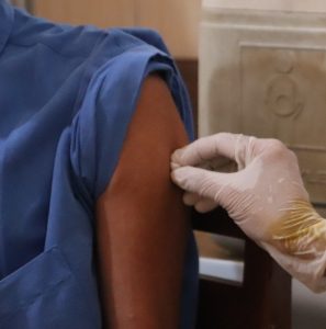 Arm being prepped for vaccine