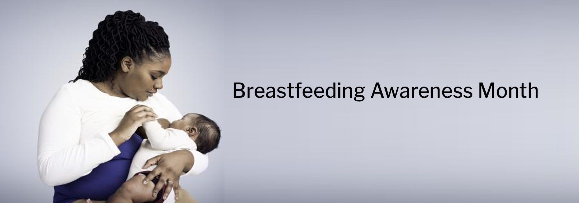 Black mother breastfeeding infant