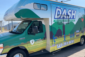 Photo of colorful van with "DASH" written on side.
