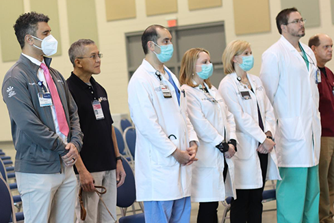 Group of doctor's standing in remembrance of fallen doctors