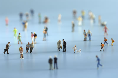 group of tiny cutout paper people