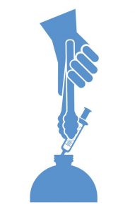 Image of a hand picking up a syringe with tongs placing it in a bottle
