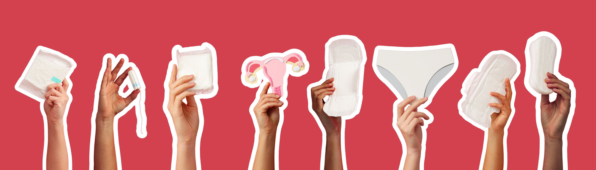 Hands holding various menstrual products