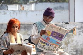 Photo of person reading newspaper