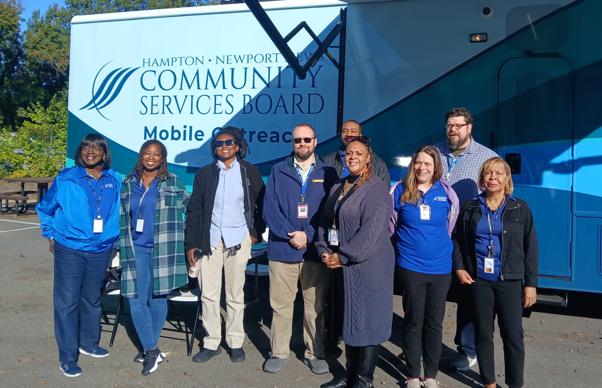 Photo of our Harm Reduction staff with the Hampton-Newport News Community Services Board staff in front of the new MAT Mobile Unit.