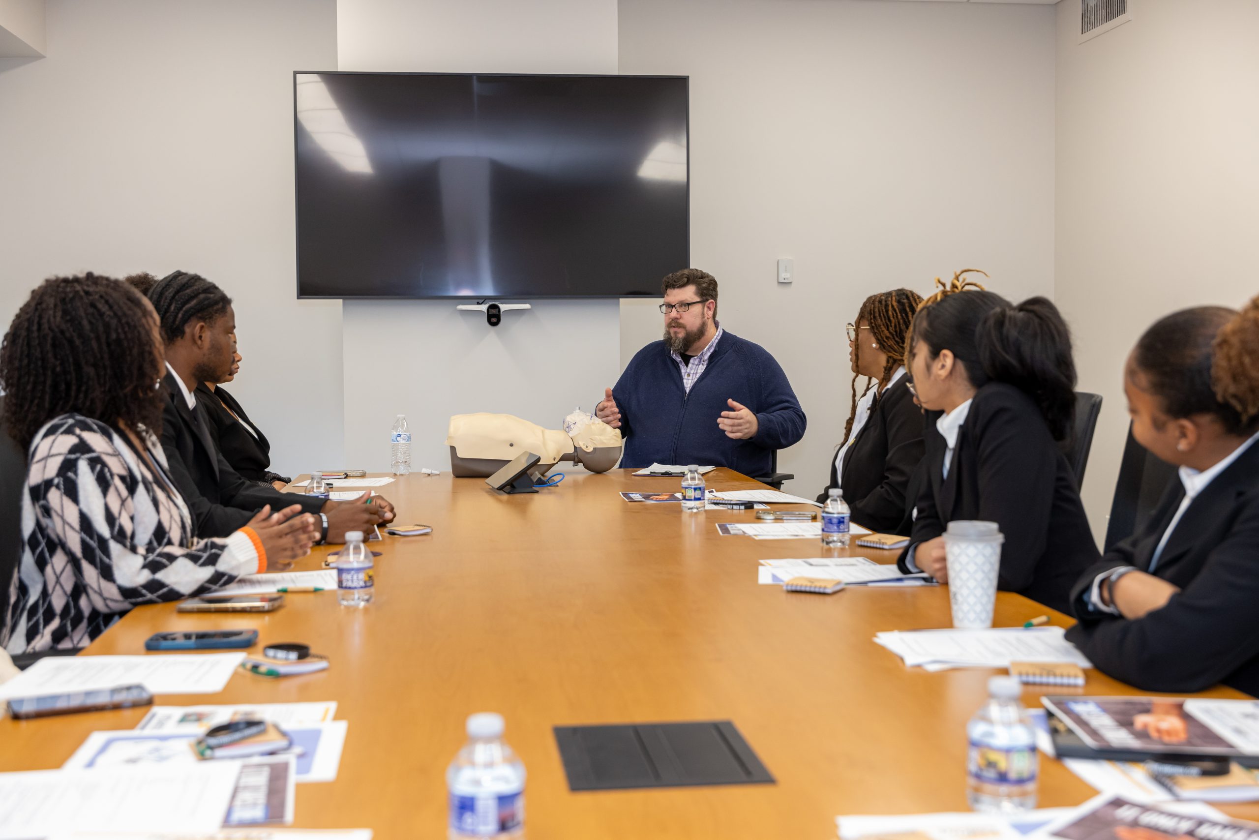 Picture of our Opioid Program Coordinator providing education to Hampton University students.