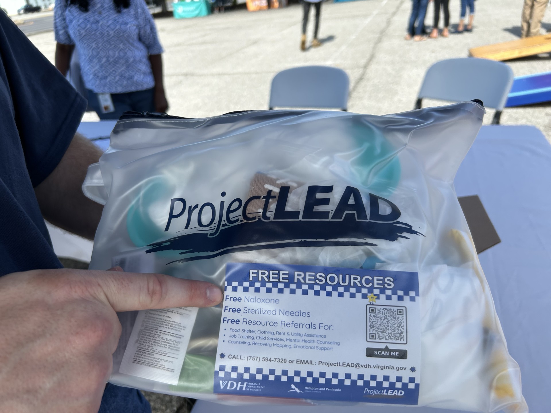 Picture of our Hygiene Kit and a resource card inside the kit.