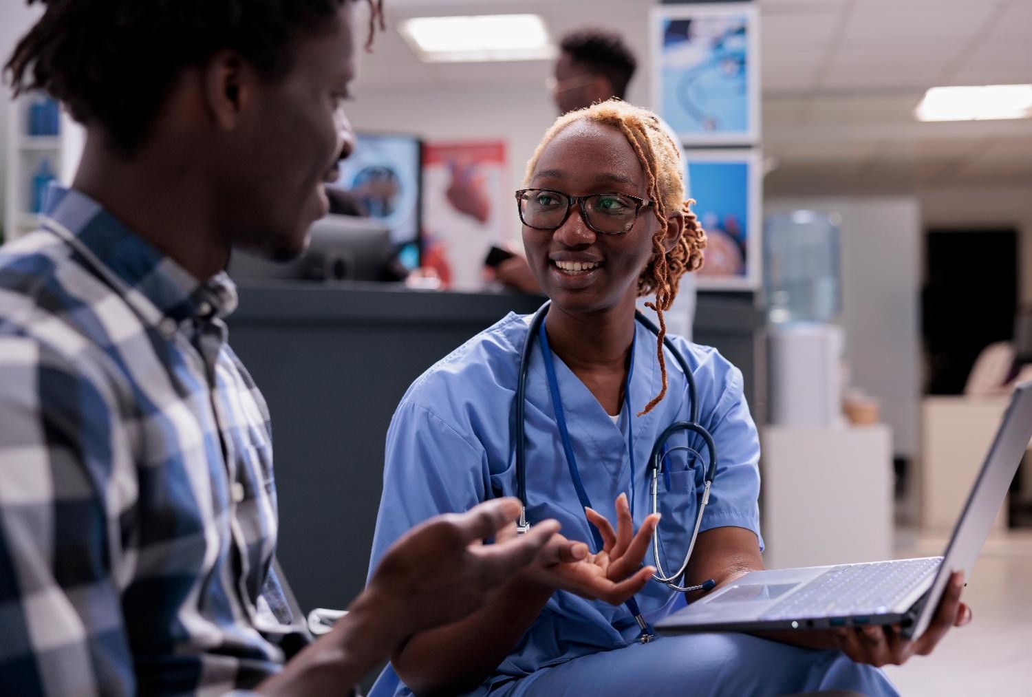 Nurse speaking with a patient in a local health clinic