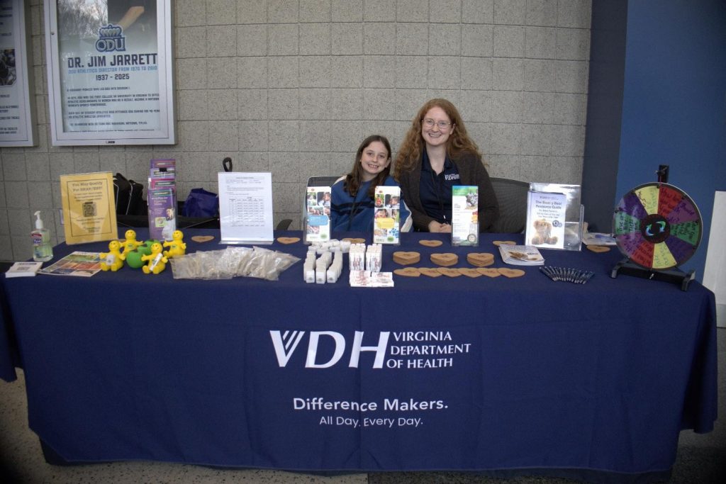 VDH staff share public health information and resources with community members at an outreach table