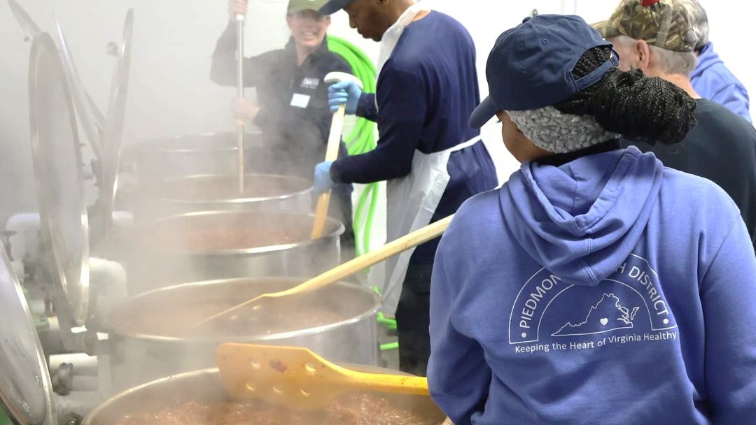 Volunteers preparing food during a community canning event to support local food access