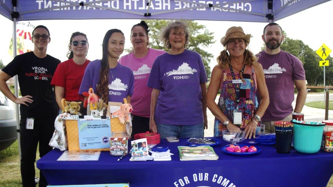 VDH staff sharing health information at a community farmers market