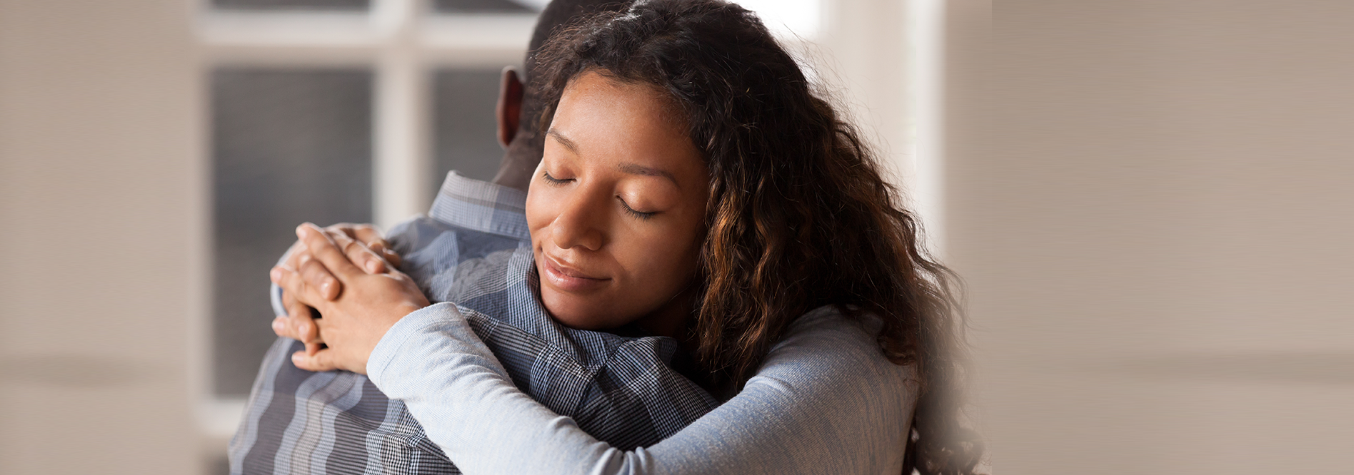 African American couple embracing.