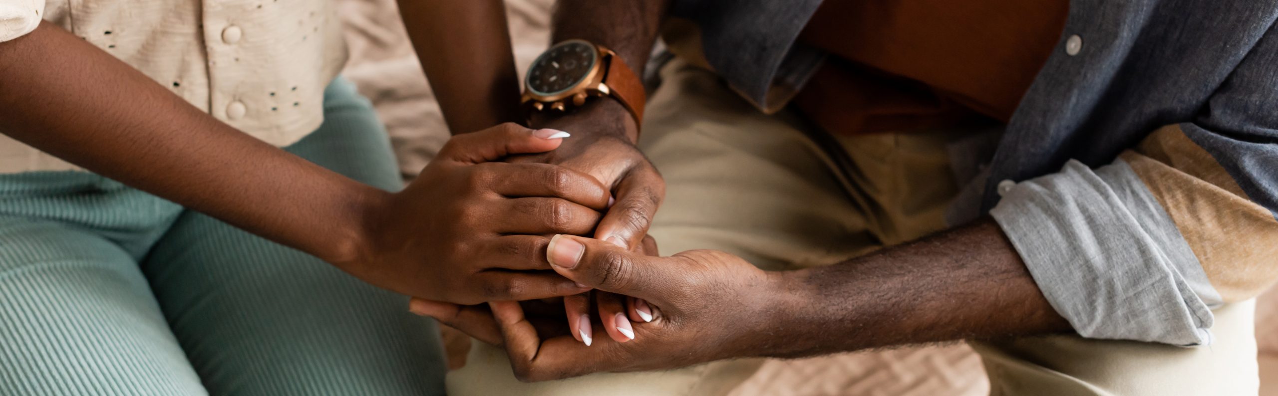 African American couple embracing.